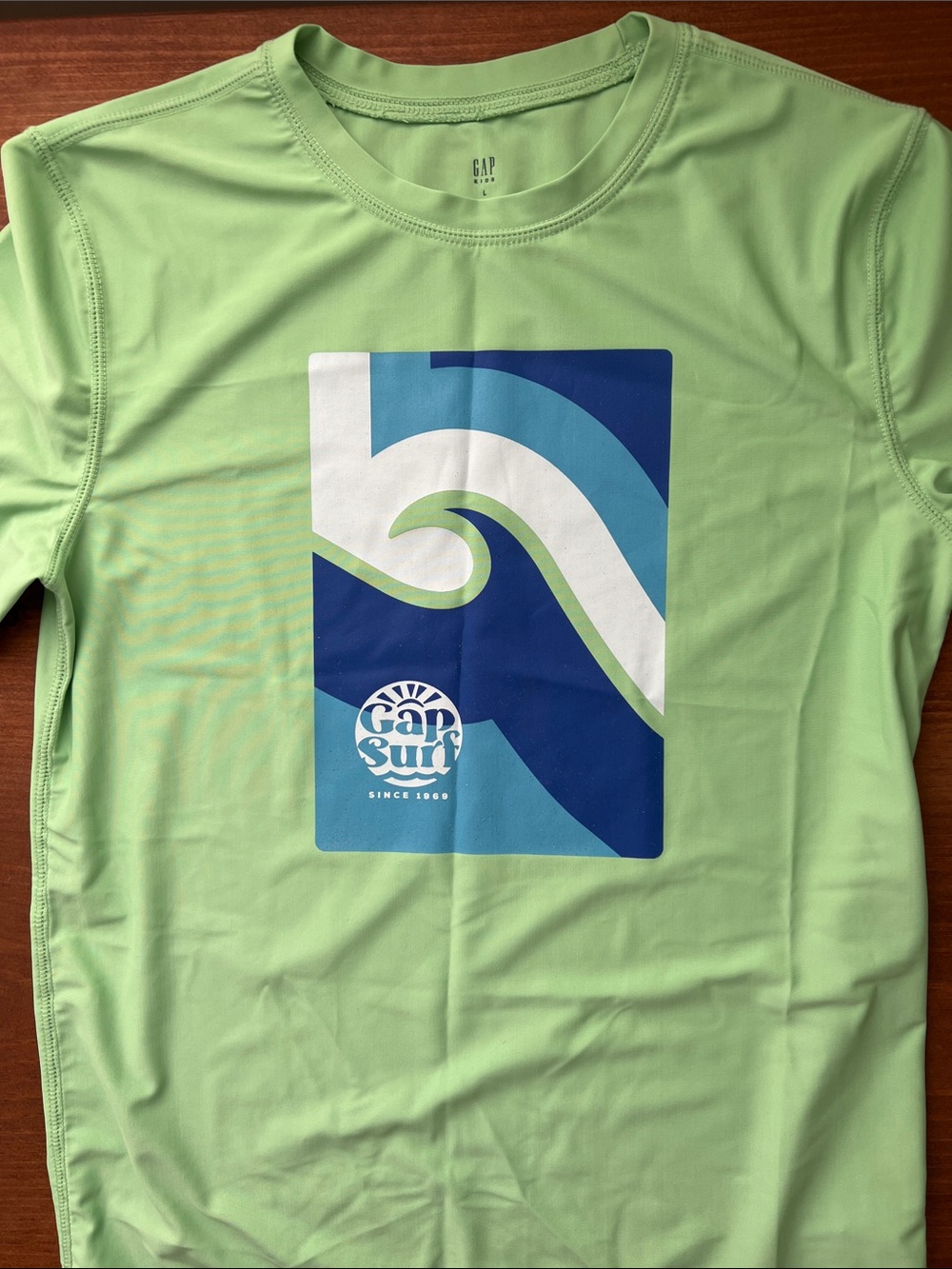 Gap Kids Light Green Swim Shirt with Blue Wave Graphic